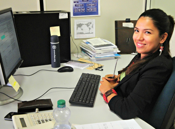 Jade sitting at her desk at FAO.