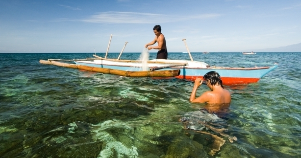 Two artisanal fishers fishing